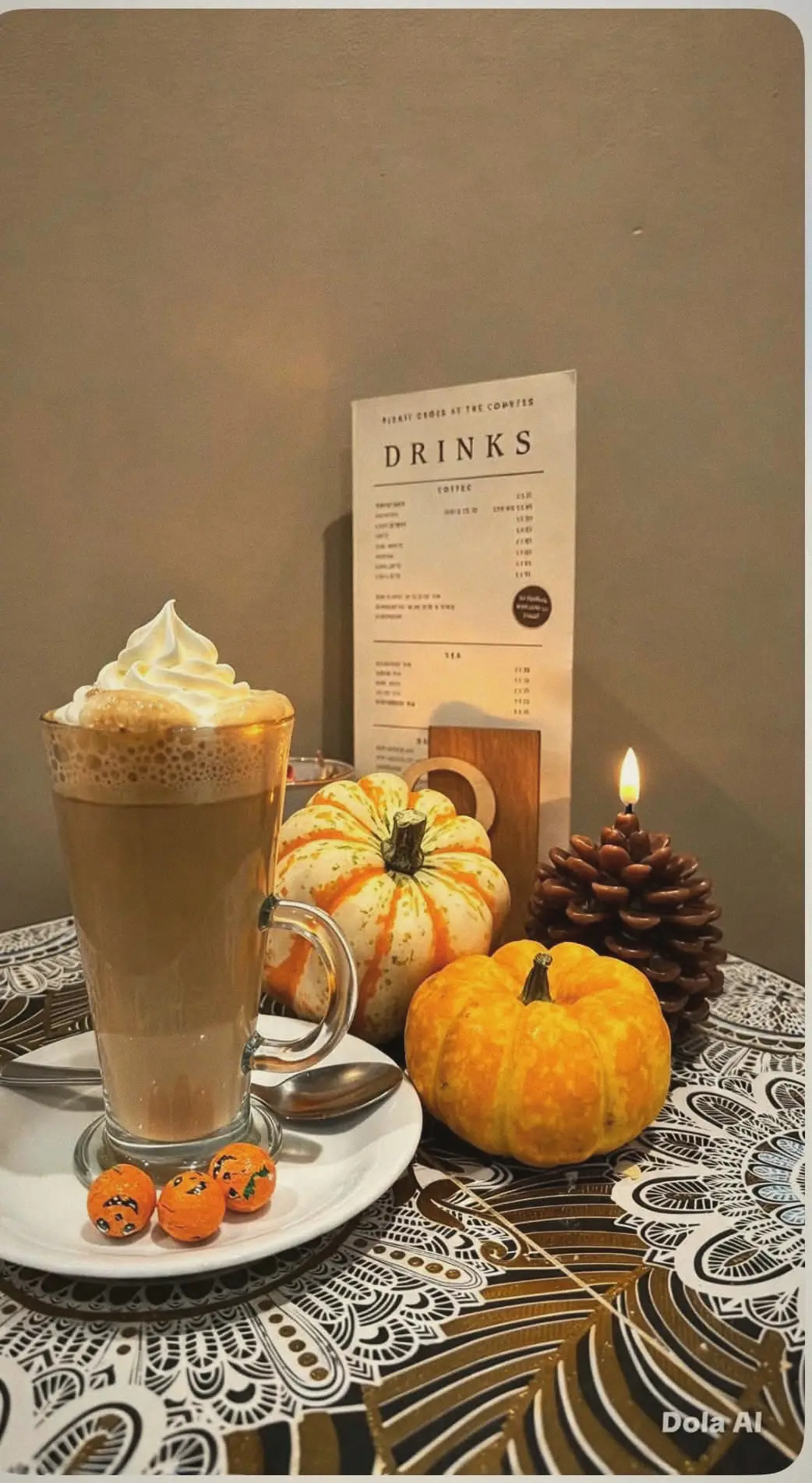 Pumpkin spice latte topped with cream