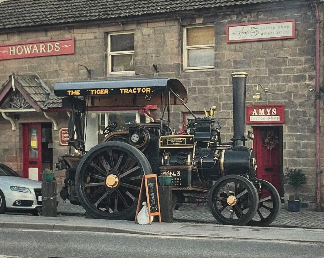 The Tiger steam tractor parked outside Amy's Coffee Shop on Market Place
